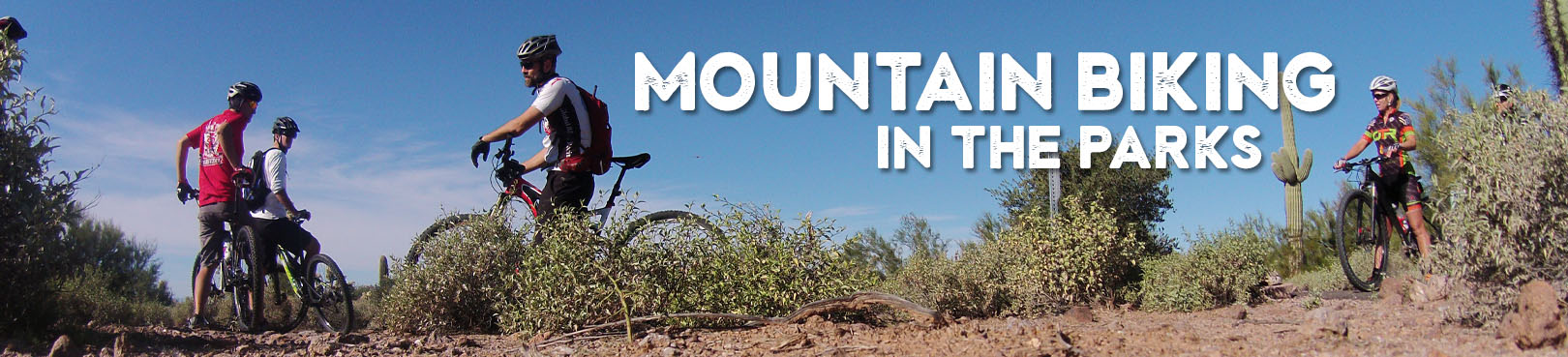 A group of mountain bikers takes a break on an Arizona desert trail.