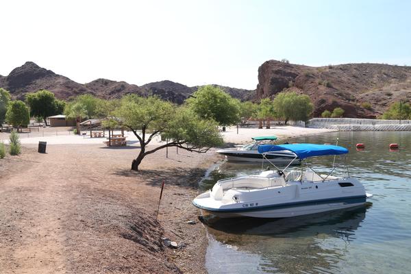A boat docked by the beach