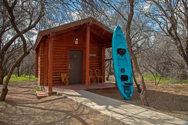 A view of the cabin with a kayak at Dead Horse Ranch State Park