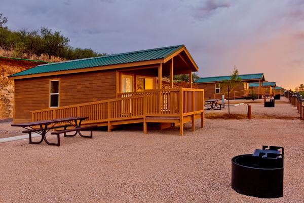 A sunset view of an accessible camping cabin at Patagonia Lake State Park
